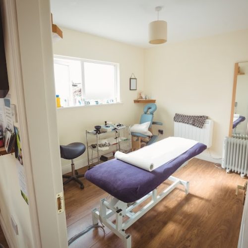 Empty examination bed in dry needling clinic